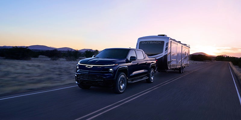 Chevrolet Silverado EV towing a large camper